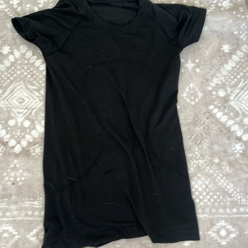 This is a lululemon swiftly shirt and is in the color black